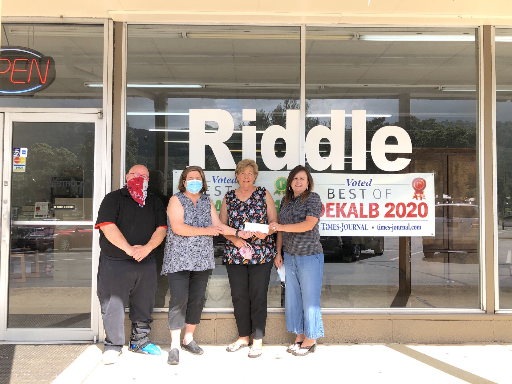 Main Street presents COVID-19 recovery check to business